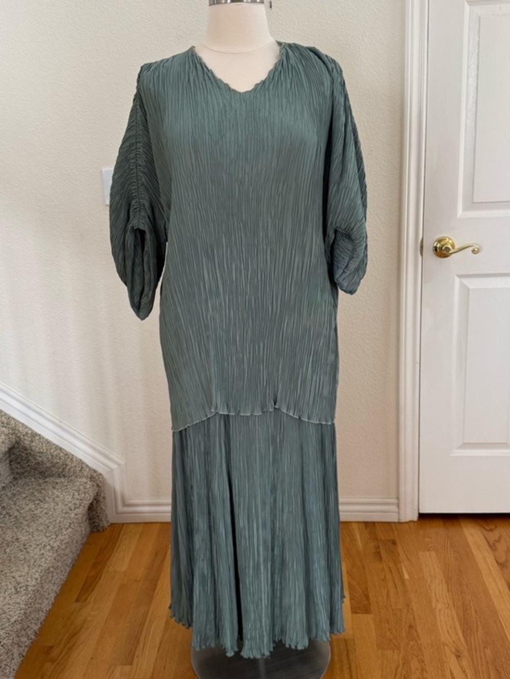 Signed, hand colored & pleated sage green top/shirt.